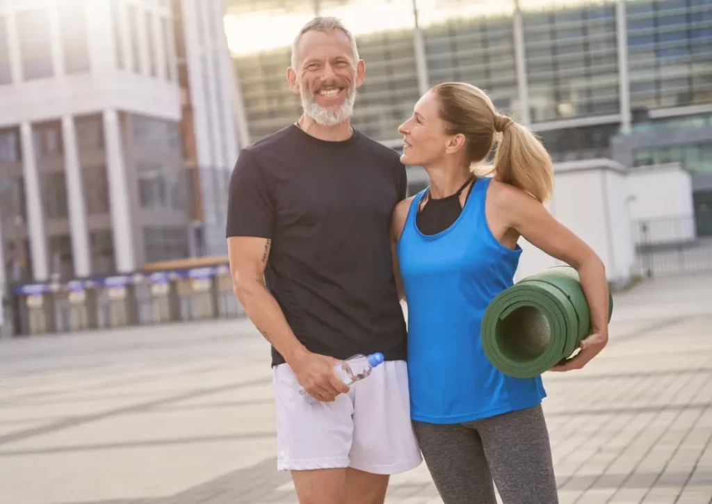 happy mature couple man and woman in sportswear p utc