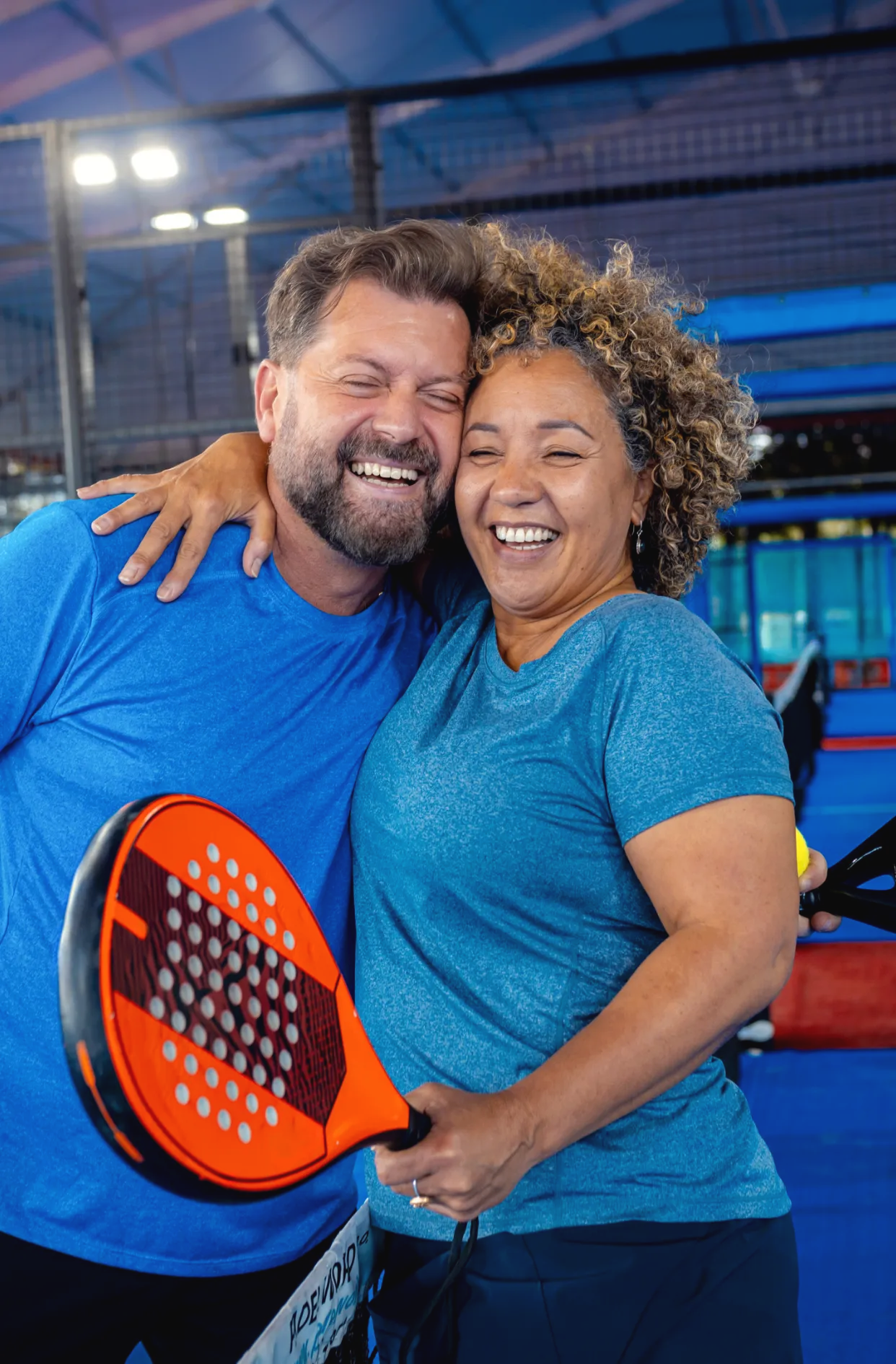 mixed adult couple celebrate winning the point in utc