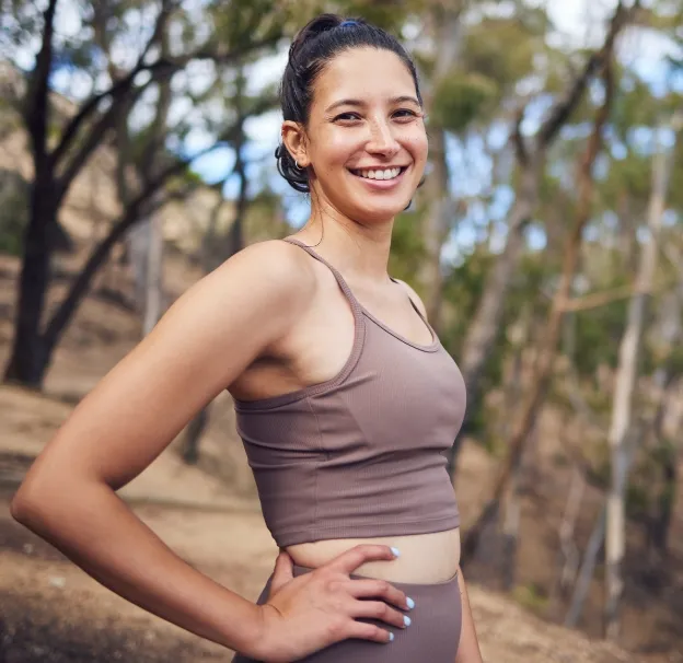 portrait of a sporty young woman standing with her utc