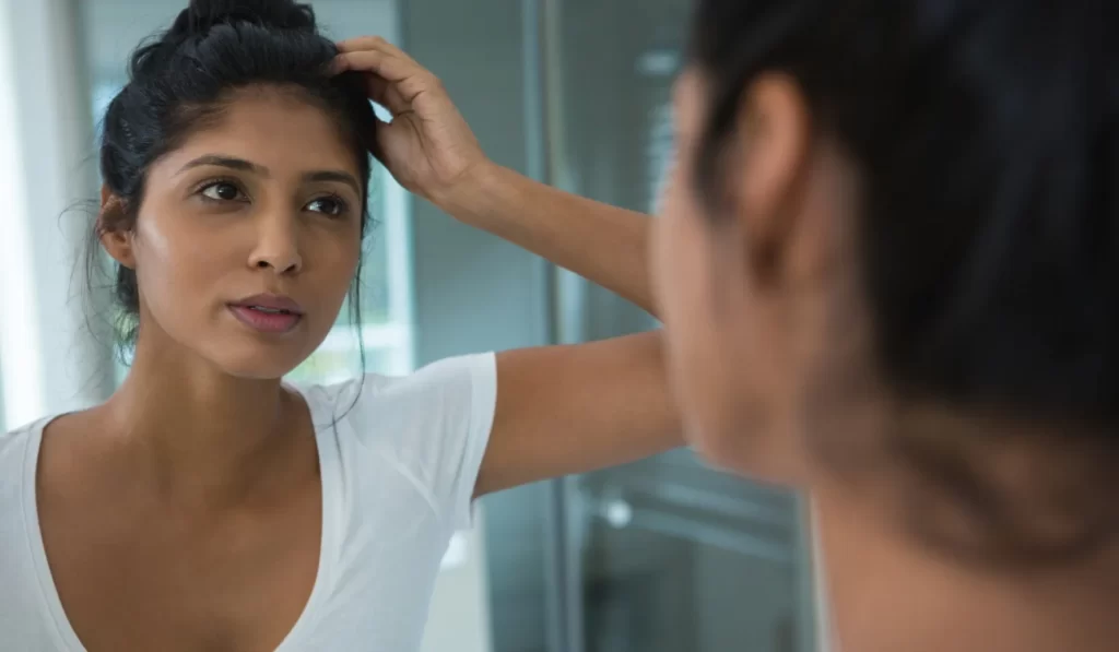 pretty woman reflecting on mirror utc